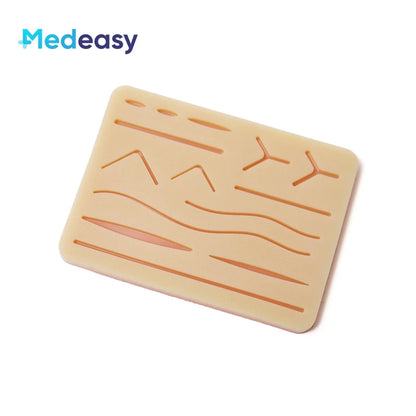 Kit Complet d'Entraînement à la Suture Médicale – Pad Silicone 3 Couches, 14 Plaies, 5 Outils Inox & Fils