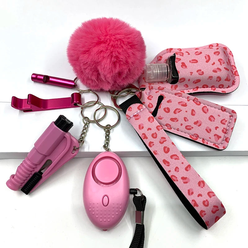 Porte-clés de survie pour femme : kit rose avec pompon, sifflet, ouvre-bouteille, porte-objets, alarme personnelle et porte-gel hydroalcoolique
